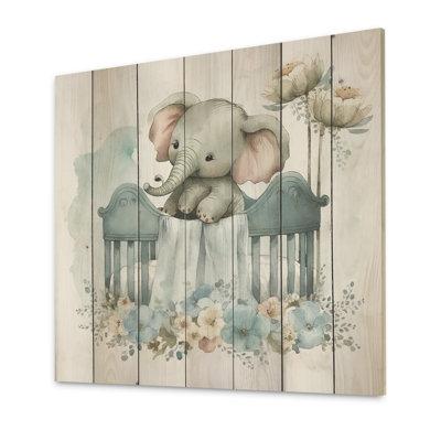 Indigo Safari Exmouth Baby Elephant In Crib w/ Flowers I - Unframed Print on Wood in Blue/Brown/Green | 16 H x 16 W x 1 D in | Wayfair