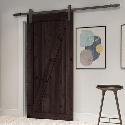 Barn Door - Millwood Pines Tarcienne Paneled Wood & Metal Finish Prehung Barn Door w/ Installation Hardware Kit Wood in Brown | Wayfair