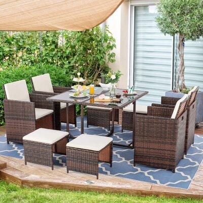 Wade Logan® Borst 9 Piece Patio Dining Set, Outdoor Space Saving Wicker Dining Furniture Set, All Weather Glass Patio Dining Table w/ Chairs Wayfair