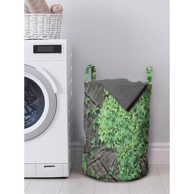 East Urban Home Foliage Botanic Life Stems from a Tree Log Root Renewal Laundry Bag Fabric in Green | 19 H x 13 W in | Wayfair