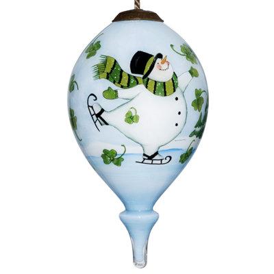 The Holiday Aisle® Ice Skating Shamrock Snowman Finial Ornament Glass in Blue | 4.75 H x 2.5 W in | Wayfair F928BC2ACCDF460AADEC908E533E32EB