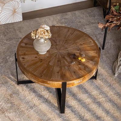 Millwood Pines Abbiss Floor Shelf Coffee Table Round Wood Coffee Table w/ Cross Metal Base Wood/Metal in Black/Brown | Wayfair